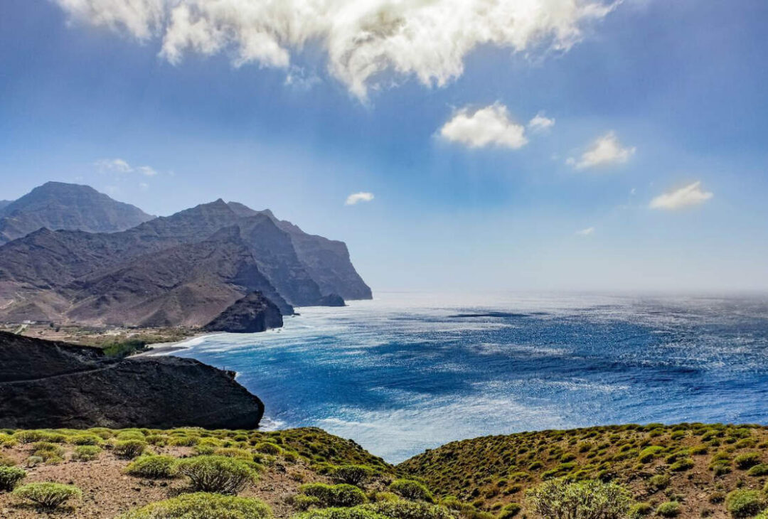 A sandy beach with clear blue water in Lanzarote