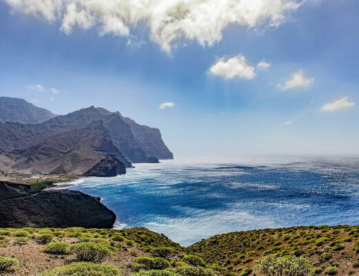 A sandy beach with clear blue water in Lanzarote